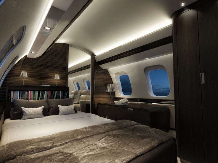 the inside of an airplane with a bed and windows