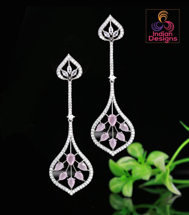 These Silver Polish Luxury Look CZ Diamond Crystal Long Drop Earrings are the epitome of luxury and style. The floral design with teardrop AD stones giving these earrings a beautiful, classy look. The CZ Diamond crystals give these earrings a sophisticated sparkle, perfect for dressing up any outfit. Whether you're going to a party or just want to add a touch of luxury to your everyday look, these earrings are the perfect choice. Luxury Look, Silver Polish, Long Drop Earrings, Cz Jewelry, Drop Dangle Earrings, American Diamond, Silver Drop Earrings, Cz Diamond, Rose Earrings