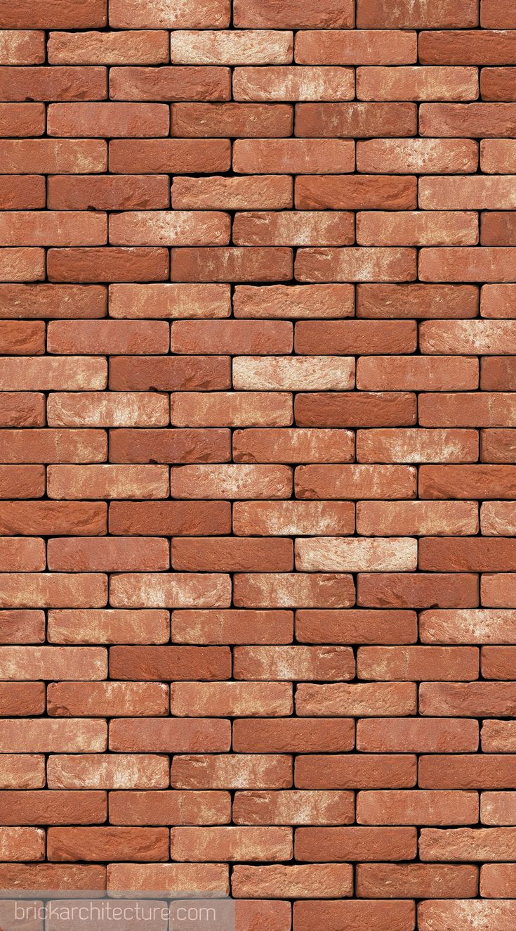 a red brick wall that is very close up