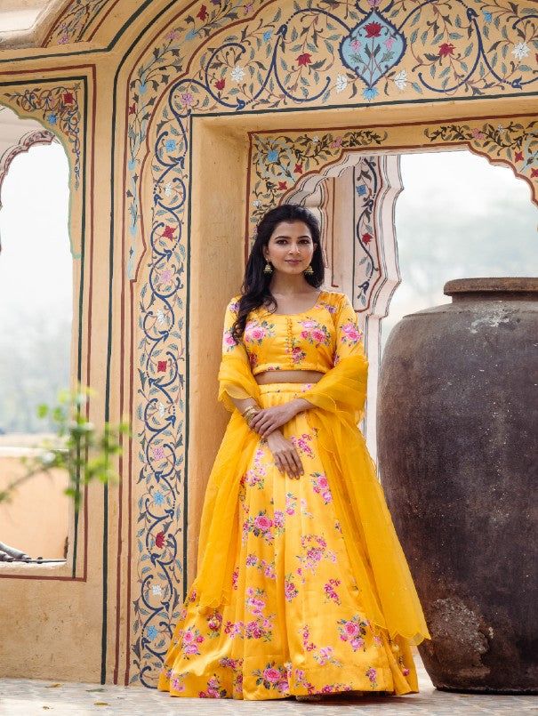 Yellow Floral Printed Satin Lehenga Set (Set of 3) By Rivaaj now available at Trendroots Fitted Organza Palazzo Set With Cutdana, Transitional Organza Lehenga With Cutdana, Festival Tissue Silk Palazzo Set For Reception, Semi-stitched Sets For Reception And Festivals, Transitional Lehenga With Pallu In Organza, Yellow Tissue Silk Sets For Transitional Season, Festive Organza Palazzo Set With Cutdana Details, Festive Organza Palazzo Set With Cutdana, Transitional Organza Lehenga With Sheer Dupatta