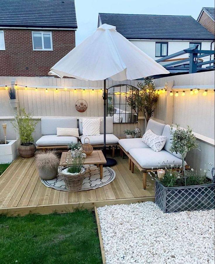 an outdoor living area with patio furniture and lights