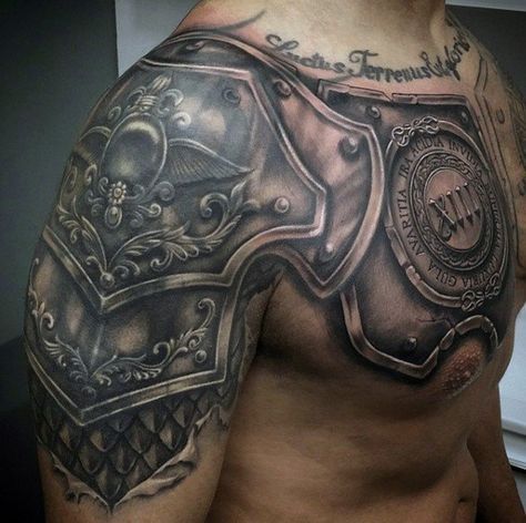 a man's chest with an armor tattoo on it