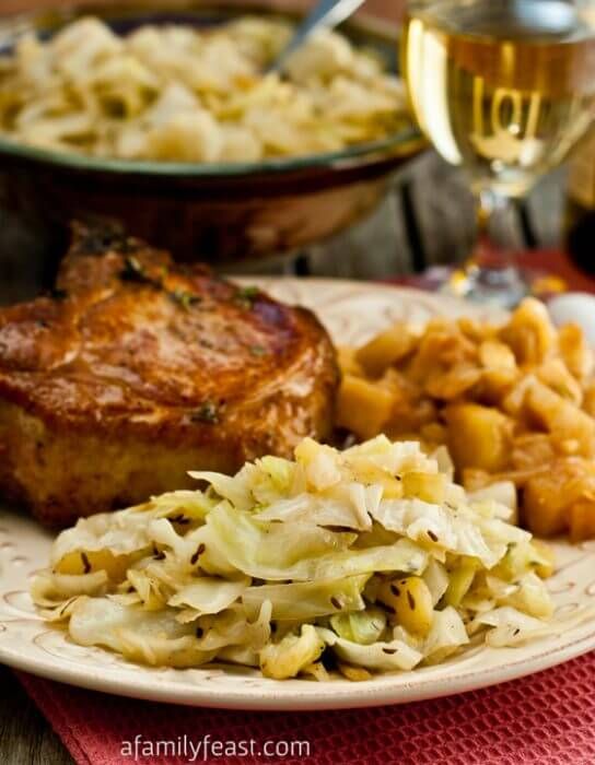 a plate with some food on it and the words braised cabbage and apples above it