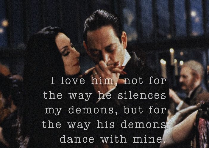 a man and woman standing next to each other with a candle in their hand, texting i love him not for the way he slices my demons, but for the way his demons