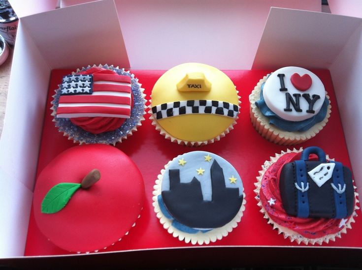 six cupcakes in a red box decorated with american flags and the words i love new york