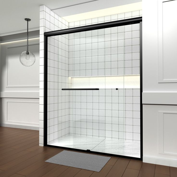 an empty bathroom with white tile and black trim on the shower door is shown in this rendering