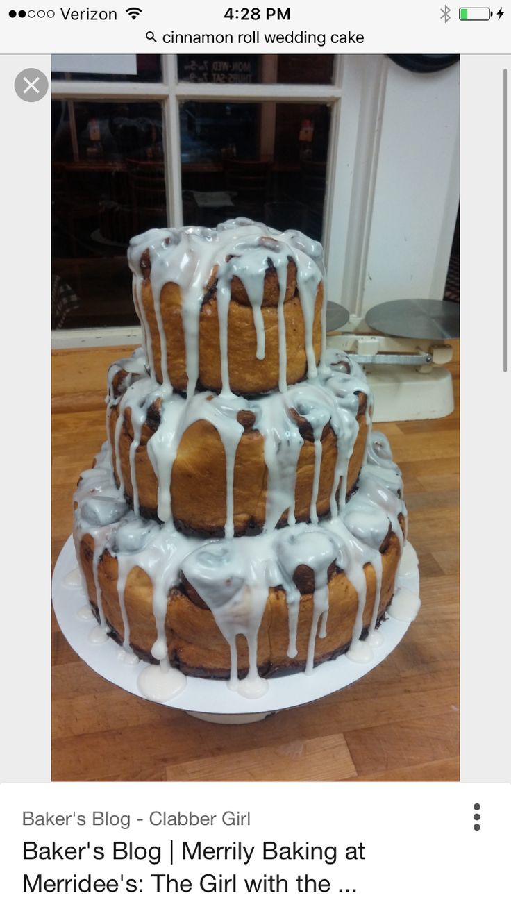 a three tiered cake with icing on top