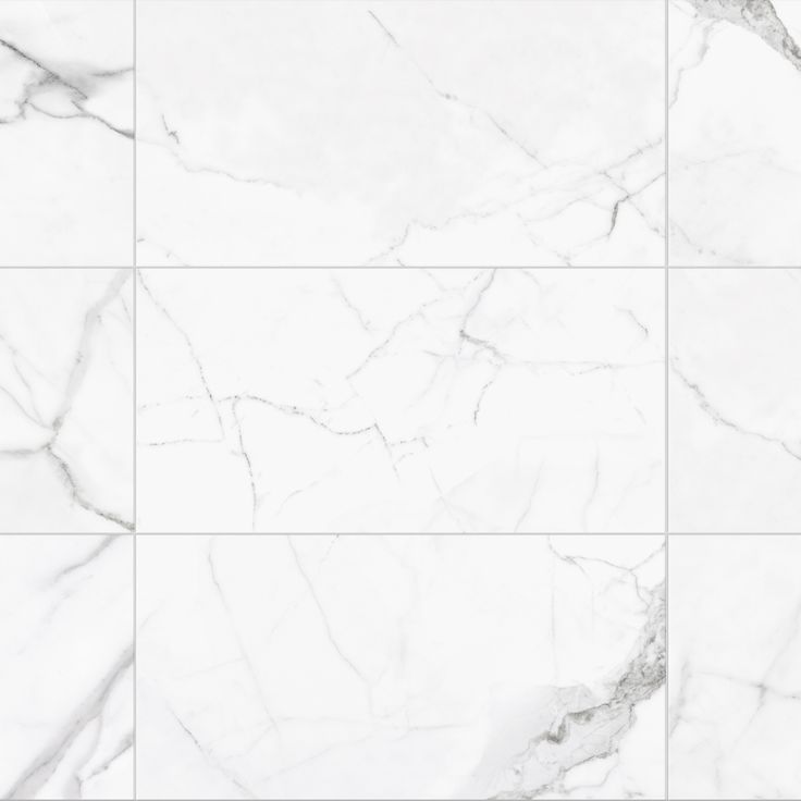 a white marble tile wall with different patterns