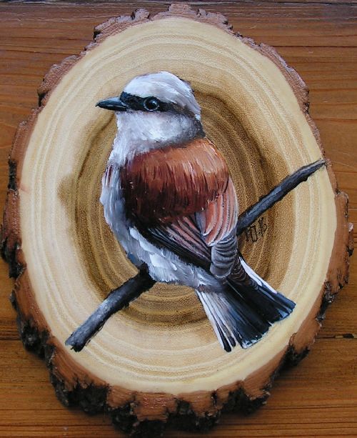 a bird painted on a piece of wood