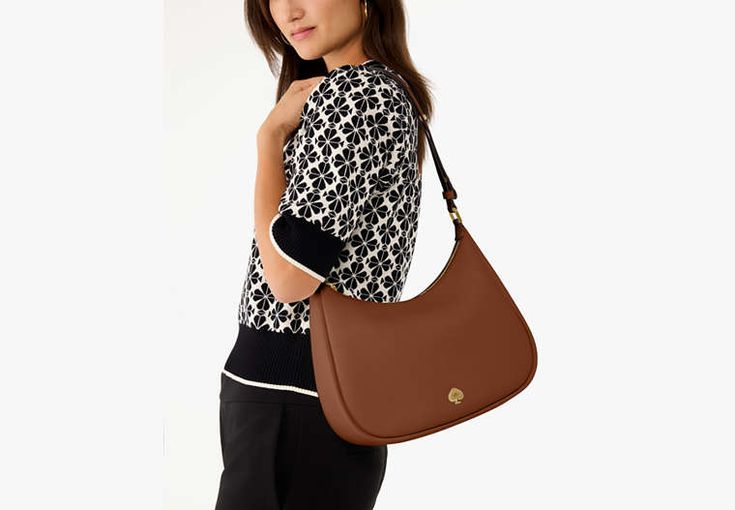 The perfect everyday style the Kayla shoulder bag is crafted from luxe pebbled leather with a metal spade detail. It features an adjustable strap and spacious interior so you can carry all your essentials with ease. | Kate Spade Kayla Large Shoulder Bag, Warm Gingerbread Kate Spade Shoulder Bag For Everyday Use, Versatile Kate Spade Shoulder Bag For Travel, Versatile Kate Spade Bags For Daily Use, Versatile Kate Spade Bag For Everyday, Kate Spade Brown Bags For Work, Kate Spade Casual Bags For Everyday Use, Versatile Kate Spade Bags, Kate Spade Versatile Bags For Daily Use, Casual Kate Spade Bag For Everyday Use