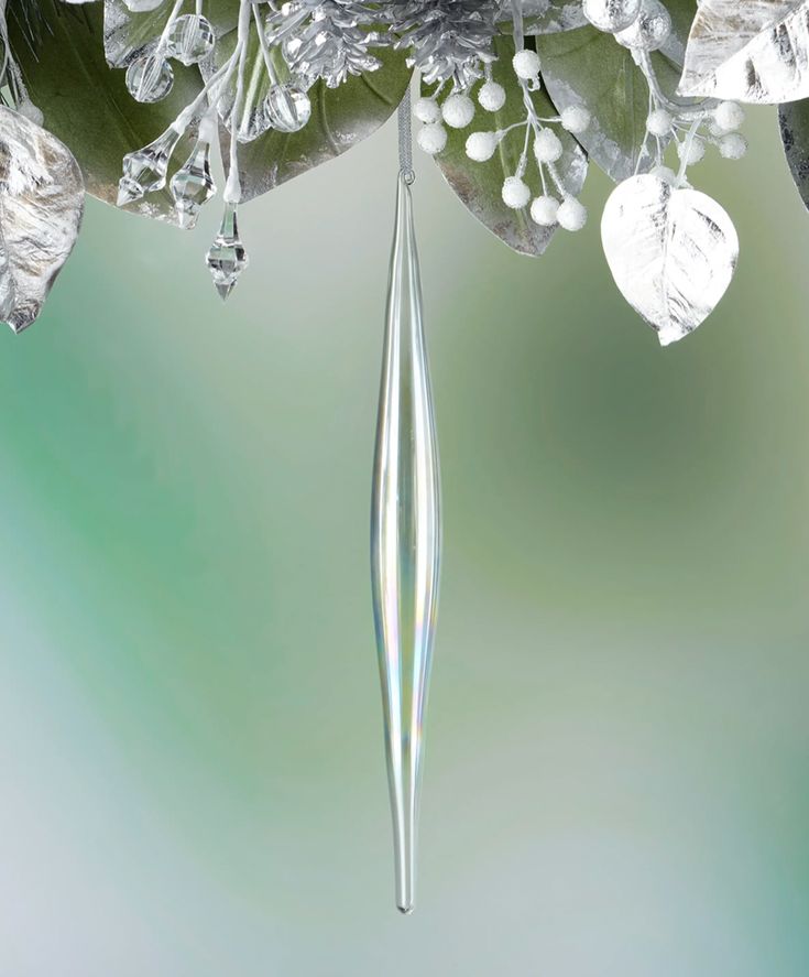 a close up view of some flowers with drops of water hanging from them