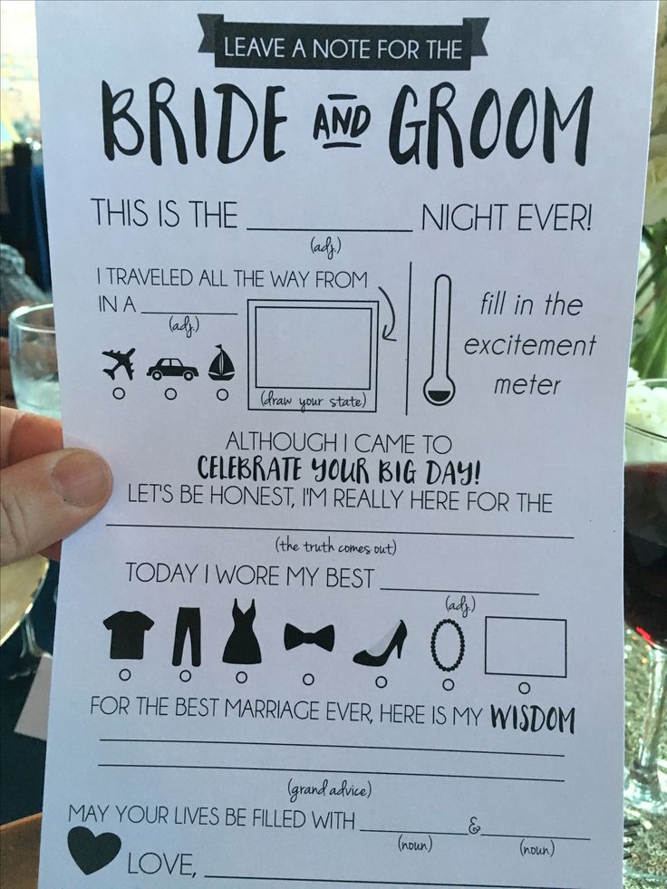 a hand holding up a paper that says, leave a note for the bride and groom