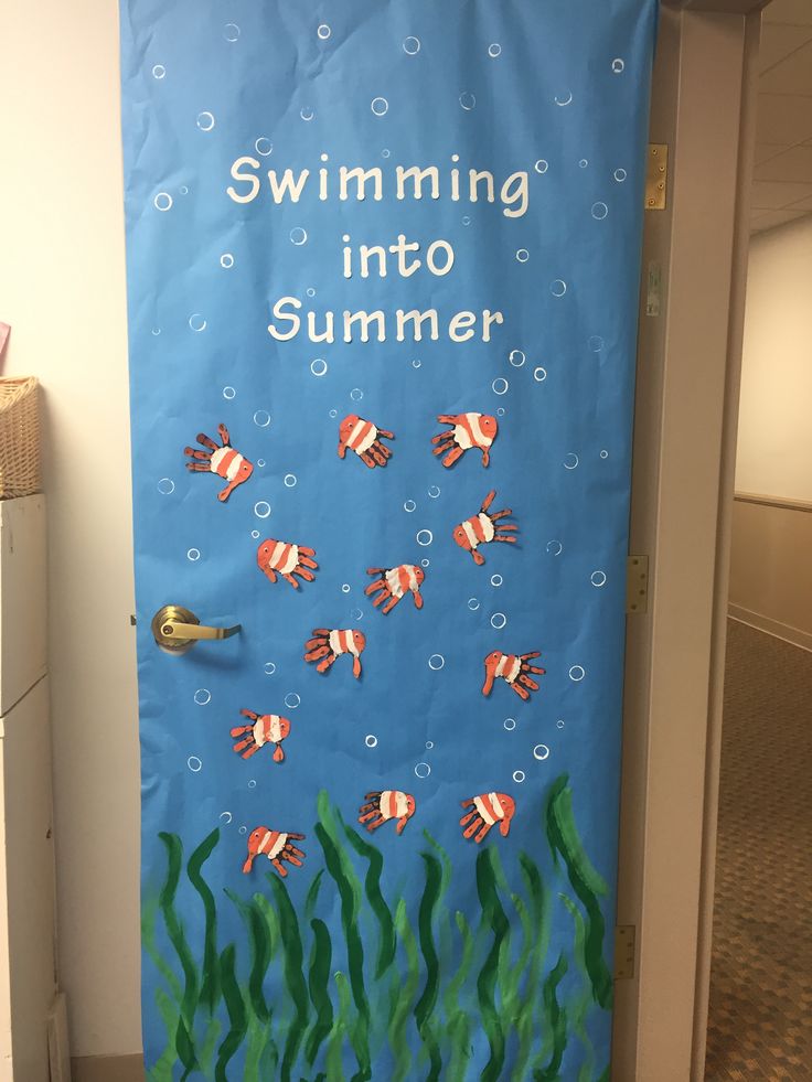 a door decorated with an image of fish swimming in the water and saying, swimming into summer