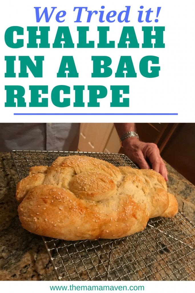 a loaf of bread sitting on top of a cooling rack with the words we tried it challah in a bag recipe