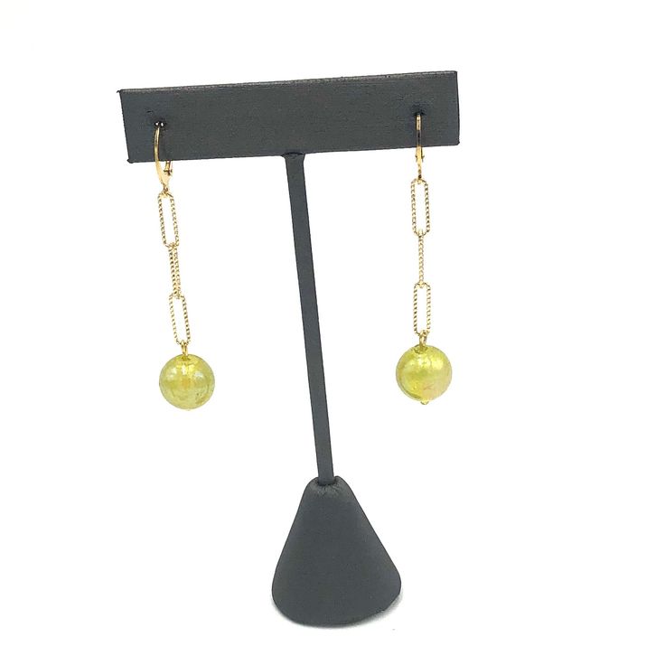 Introducing our Chartreuse Aurora Chain Cuff Earrings – the perfect combination of style and sophistication. These unique earrings feature a vibrant chartreuse bead and a sleek cuff design. Elevate any outfit and make a statement with these must-have accessories. Earrings measure 2 3/8" long and 1/2" wide. Hypoallergenic gold plated leverback cuff style earwires. Earrings are made with vintage lucite parts that were made in Rhode Island in the 1960's - early 80's by Best Plastics. Adjustable Chain Party Earrings, Adjustable Beaded Chain Earrings For Party, Adjustable Elegant Lime Green Jewelry, Green Beaded Chain Earrings, Elegant Adjustable Beaded Earrings With Beaded Chain, Green Linear Earrings For Parties, Elegant Yellow Dangle Clip-on Earrings, Elegant Adjustable Beaded Earrings, Elegant Lime Green Jewelry With Round Beads