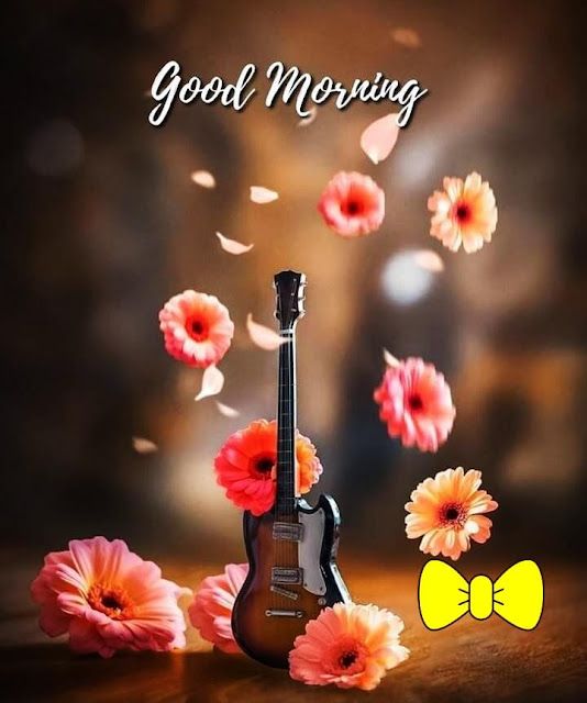 a guitar and flowers on a table with the words good morning