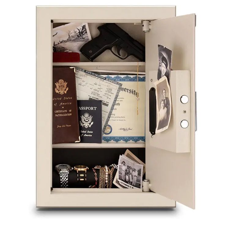 an open safe with various items and papers on the shelf next to eachother