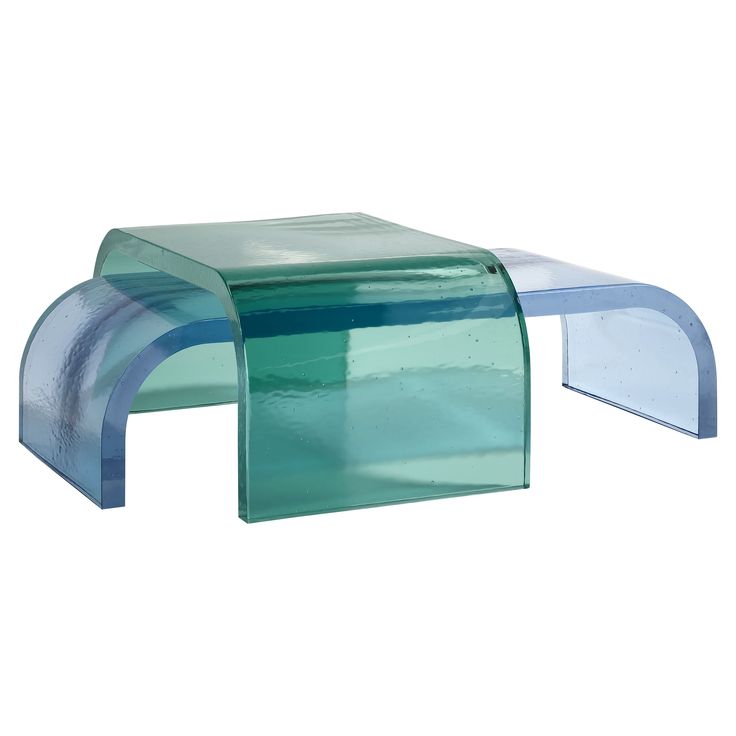 a blue and green glass coffee table with curved legs