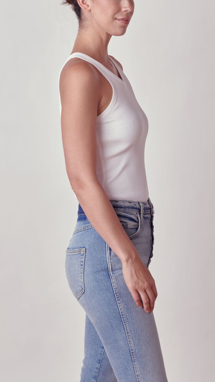 Description The Long Rib Tank Body Suit in White by Amo Denim is made from our original, custom rib fabric in a sleek, comfortable silhouette. With snap enclosures, this bodysuit can be styled with a high waisted denim for a casual weekend look. 100% mid-weight cotton. Machine wash cold. Measurements Taken from a size small 22 3/4" in length from the shoulder Rib Fabric, Tank Bodysuit, Casual Weekend, Sand Beige, Body Suit, Thom Browne, High Waisted Denim, Ribbed Fabric, Denim Top