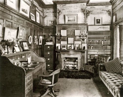 an old black and white photo of a living room with a piano in the corner