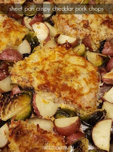 a close up of food on a pan with potatoes and other foods in it,