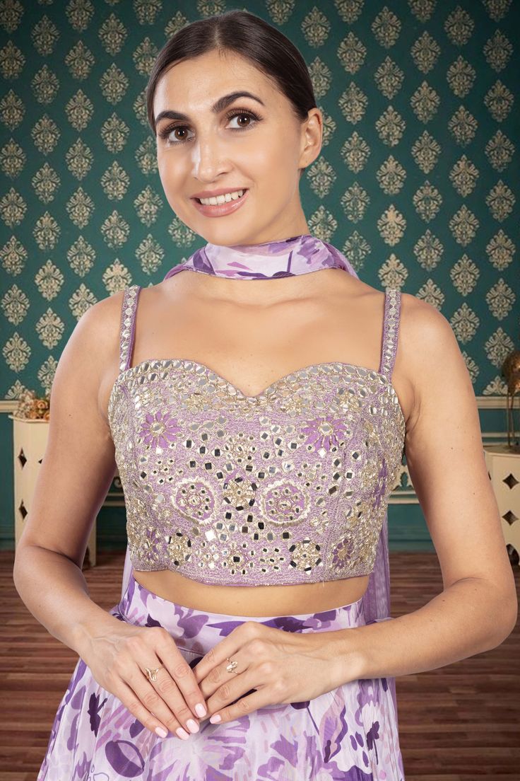 Inspire awe and radiate confidence with our Party Wear Lehenga D-347. Adorned with exquisite mirror embroidery on the blouse and a stunning printed lehenga, this ensemble will make you feel like a true fashionista. Embrace your unique style and stand out from the crowd at any event. Purple Georgette Palazzo Set With Traditional Drape, Traditional Drape Purple Georgette Palazzo Set, Sleeveless Party Wear Sets With Resham Embroidery, Sleeveless Resham Embroidery Party Wear Sets, Navratri Purple Palazzo Set With Cutdana, Purple Palazzo Set With Mirror Work For Festive Occasions, Sleeveless Party Wear Palazzo Set For Festive Occasion, Sleeveless Party Wear Palazzo Set For Festive Season, Sleeveless Palazzo Set For Festive Party