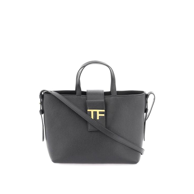 Tom Ford Crossbody Bag Crafted In Grained Leather With Iconic Gold-Tone Metal Tf Detail. Magnetic Button Closure, Microfiber Lined Interior With One Open Pocket, Double Top Handles For A Hand Look, Adjustable And Removable Shoulder Strap. Finished With Gold-Tone Lettering Logo Print On The Back. Materal: 100% Leather. Made In: Italy. Color: Black. Collection: Fall - Winter 2023. Sku: L1603 Lcl297g. Width: 25 Cm Height: 16 Cm Depth: 11 Cm Shoulder Strap: 107 Cm Handle Drop: 10 Cm. Modecraze Is An Top Handle Bags With Logo Hardware For Work, Workwear Shoulder Bag With Logo Hardware And Double Handle, Office Bag With Logo Hardware And Double Handle, Leather Shoulder Bag With Logo Hardware For Work, Leather Shoulder Bag With Logo For Work, Leather Shoulder Bag For Work With Logo Hardware, Luxury Shoulder Bag With Logo Hardware For Work, Elegant Everyday Satchel With Logo Hardware, Classic Office Bag With Logo Hardware