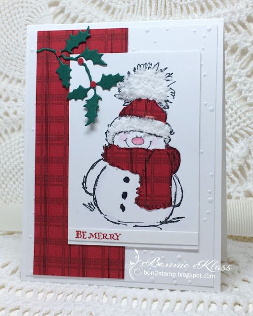 a christmas card with a snowman wearing a hat and scarf on it's head