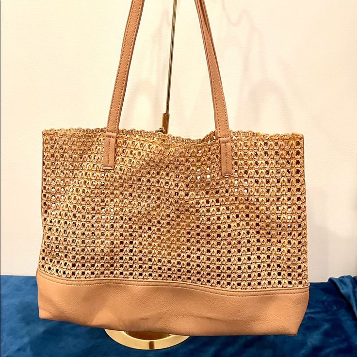 Light Tan Vegan Leather Tote. Come With A Matching Pouch Attached Inside. This Has Never Been Used And Is Still Brand New With Tags. 16x12.5x3 Inches Casual Shopping Bags With Gold-tone Hardware, Natural Bags With Gold-tone Hardware For Shopping, Natural Color Bags With Gold-tone Hardware For Shopping, Natural Everyday Bags With Gold-tone Hardware, Casual Bags With Gold-tone Hardware For Errands, Natural Bags With Gold-tone Hardware For Daily Use, Tan Shoulder Bag With Braided Handles For Shopping, Casual Shoulder Bag With Gold-tone Hardware For Errands, Natural Shoulder Bag With Gold-tone Hardware For Shopping