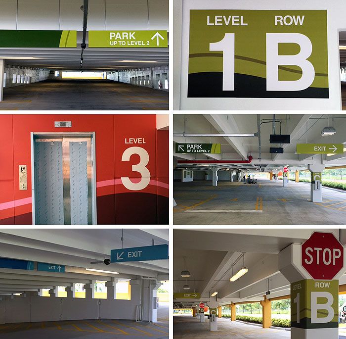 there are several parking garages with different signs on the doors and in between them