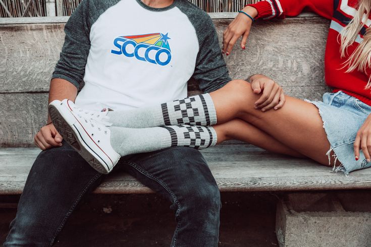 Ready to rock a pair of socks that scream 'rad' louder than a boombox at a breakdance battle? Meet SOCCO's Black Checkered Socks in Heather Grey - your ticket to footloose freedom and fashion-forward flair, with a nod to the 80s style. Made with love in the USA, these socks aren't just comfy; they're a statement. Full foot and leg cushioning: Like walking on a cloud made of cool. Moisture-wicking & breathable: Keeps your feet fresh from dawn 'til dusk. Functional heel: Fits like it was meant jus Casual Sports Socks, Casual Cotton Socks For Streetwear, Casual White Socks With Graphic Print, Casual Cotton Streetwear Socks, Black Go-dry Sporty Socks, White Casual Socks With Graphic Print, Casual Graphic Print Socks For Streetwear, Thrasher Socks, Checkerboard Socks