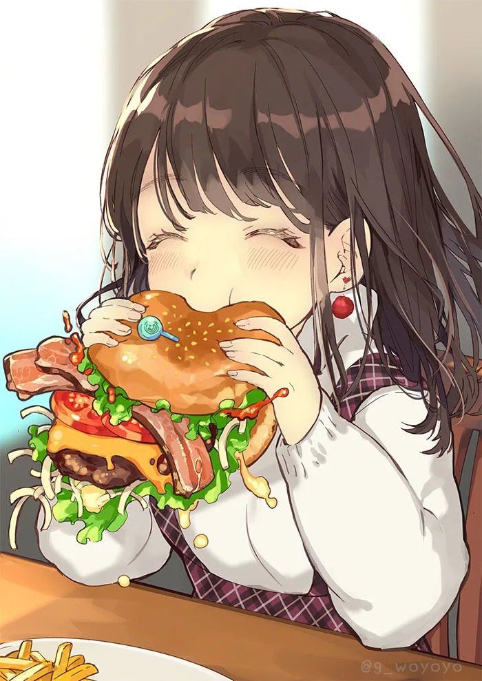 a girl eating a giant hamburger at a table with french fries in front of her