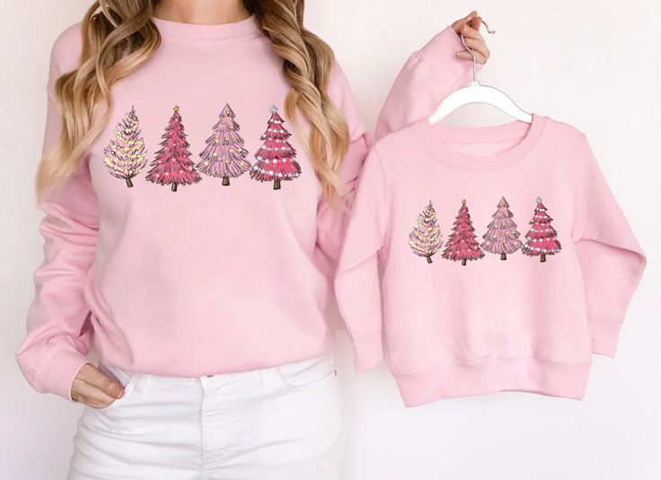 "Mommy and Me Christmas Sweatshirt, Pink Christmas Sweaters, Matching Mom and Me Christmas, Matching Christmas Shirt, Christmas Outfit **PLEASE NOTE: THIS IS NOT A SET - SWEATSHIRTS MUST BE PURCHASED SEPARATELY IN ORDER TO RECEIVE BOTH MAMA AND MINI SWEATSHIRTS. IF YOU HAVE ANY QUESTIONS FEEL FREE TO REACH OUT ANYTIME AND WE WILL BE HAPPY TO ASSIST YOU. H O W T O O R D E R 1. Simply select the size of your hoodie individually and then click \"Add to Cart\" 2. Repeat each step for each hoodie tha Matching Christmas Shirts, Christmas Sweaters For Women, Matching Mom, Christmas Tree Shirt, Christmas Crewneck, 80s Outfit, Pink Christmas Tree, Mini Christmas, Winter Sweatshirt