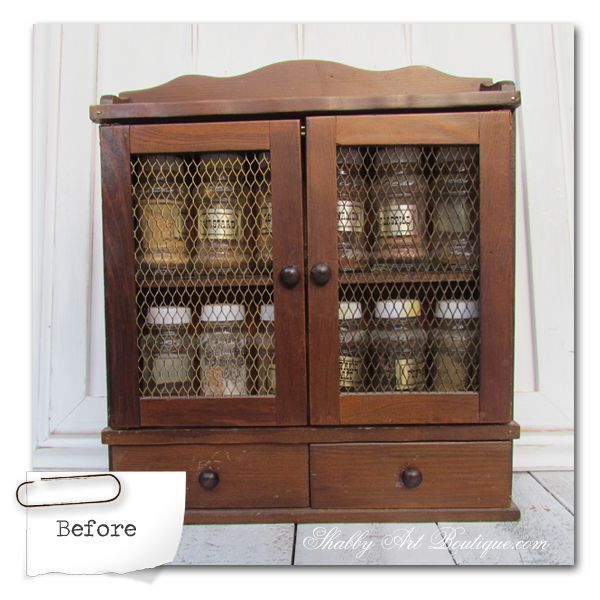 an old wooden cabinet with glass doors