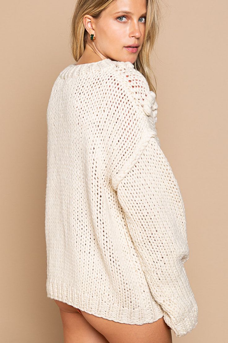 -Color: Cream -Pom pom accents -Oversized fit with long sleeves -Round neckline -Outseaming detailing -Length :23" -Bust: 24" -Content: 100% Acrylic -Imported -Mode is wearing size Small Textured Knit Long Sleeve Top, White Balloon Sleeve Sweater For Fall, Chunky Knit Long Sleeve Outerwear, Oversized Long Sleeve Sweater, Cream Long Sleeve Top For Fall, Winter White Long Sleeve Sweater, Oversized Long Sleeve Top In Winter White, Winter White Oversized Long Sleeve Top, Oversized Winter White Long Sleeve Top