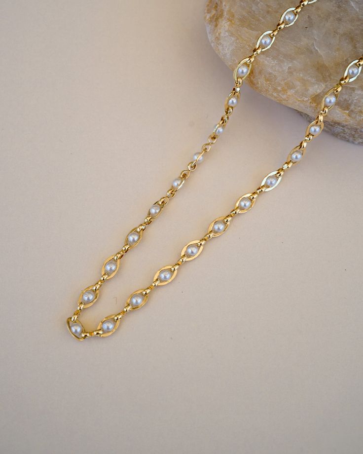 Our Pippa Pearl Choker is your new favorite choker! What do we love about it? The tiny pearl accents add just a touch of traditional style in a modern way! This choker is perfect for any bridal event but can also be worn any time of the year or for any occasion which makes this the perfect gift! FEATURES Choice of Materials: Brass, Choice of Yellow Gold or Rhodium Plating Faux pearl accents Dimensions: 16" with a 2" extender Chic Pearl Chain Choker, Chic Pearl Choker For Wedding, Chic Pearl Chain Choker Necklace, Chic Gold Pearl Chain Choker, Pearl Chain Necklace For Wedding, Chic Pearl Choker Necklace For Wedding, Delicate Pearl Chain Choker Necklace, Classic Pearl Chain Necklace For Wedding, Pearl Choker Necklace For Wedding