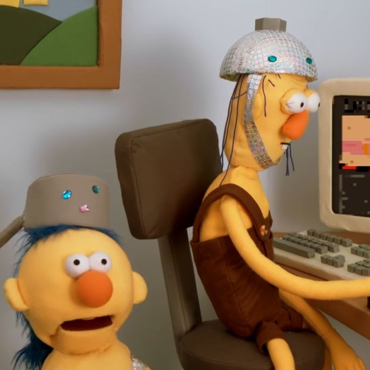 the simpsons character is sitting in front of a computer