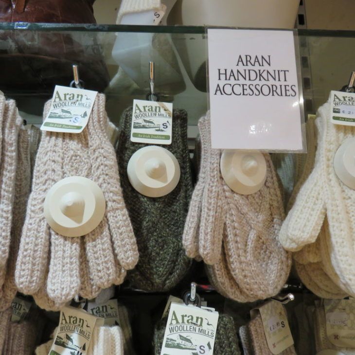 gloves and hats are on display in a store