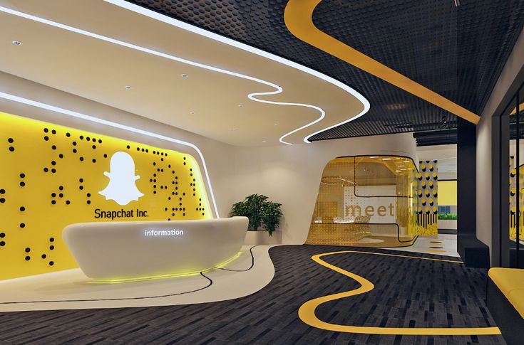 the interior of a modern office with yellow accents