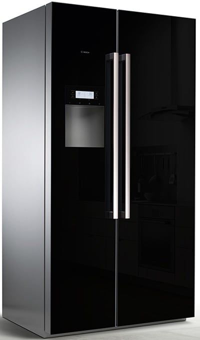 a black refrigerator freezer sitting inside of a kitchen