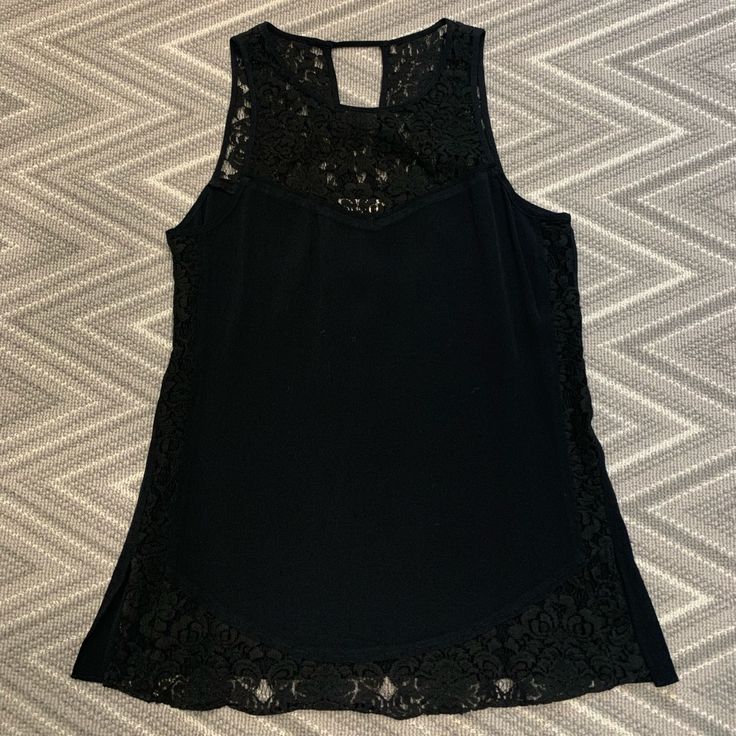 Black Sleeveless Blouse With Lace Tank Vest Blouse For Night Out, Black Sleeveless Vest Top, Chic Sleeveless Lace Top Camisole, Black Cami Vest For Night Out, Black Tank Blouse With Vest Detail, Chic Black Lace Camisole Top, Black Sleeveless Vest For Spring, Chic Black Sleeveless Top, Black Vest Tank Blouse