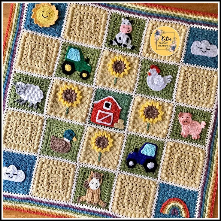 a crocheted blanket with farm animals, sunflowers and other things on it