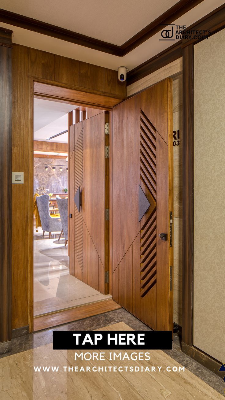 an entry way with two wooden doors and glass panels on the front door, leading to another room