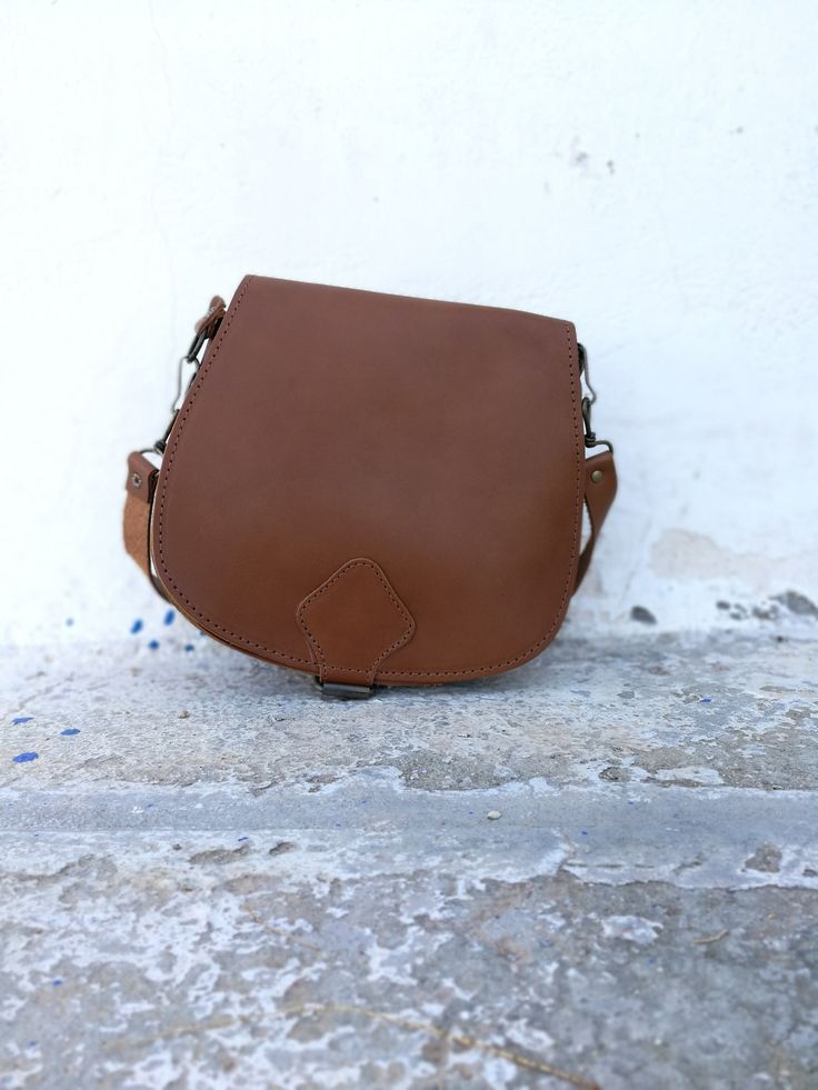 New Brown Saddle bag with adjustable cross body strap. Custom made bag in plenty of colors with adjustable strap. This is the perfect IT bag for this season all across runways and celebrities. Dimensions: SMALL: 20*22 cm MEDIUM: 22*28 cm LARGE: 25*28*10 cm Strap: 125 cm All Bags are made to order. If you like this bag, please see our full collection in the below link: https://www.etsy.com/shop/madammeshushu?section_id=17490770&ref=shopsection_leftnav_3 More on who we are Welcome to my store Everyday Use Saddle Flap Bag With Adjustable Strap, Everyday Saddle Flap Bag With Adjustable Strap, Everyday Saddle Bag With Detachable Strap, Daily Use Saddle Bag With Adjustable Strap, Saddle Bag With Detachable Strap For Daily Use, Saddle Bag With Adjustable Strap For Daily Use, Daily Saddle Bag With Adjustable Strap, Everyday Use Saddle Flap Bag With Detachable Strap, Saddle Flap Bag With Detachable Strap For Everyday Use