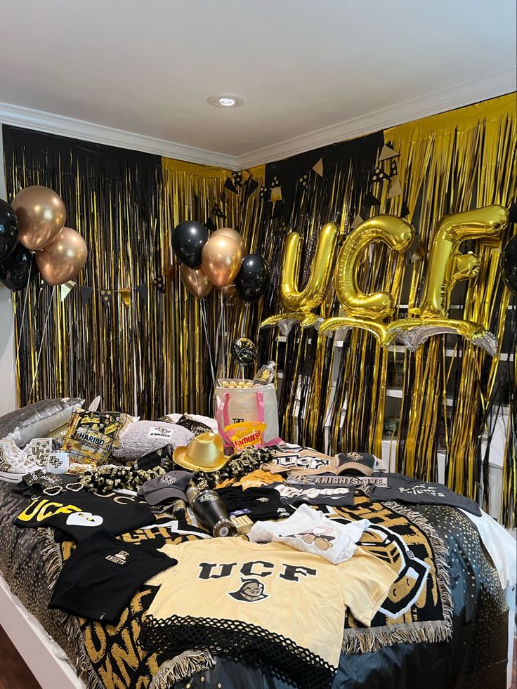 a sports themed bed room with balloons and streamers