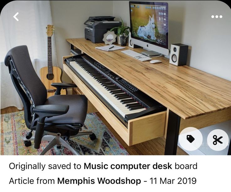 a computer desk with a keyboard and monitor on it