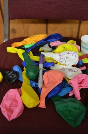 a pile of colorful items sitting on top of a chair