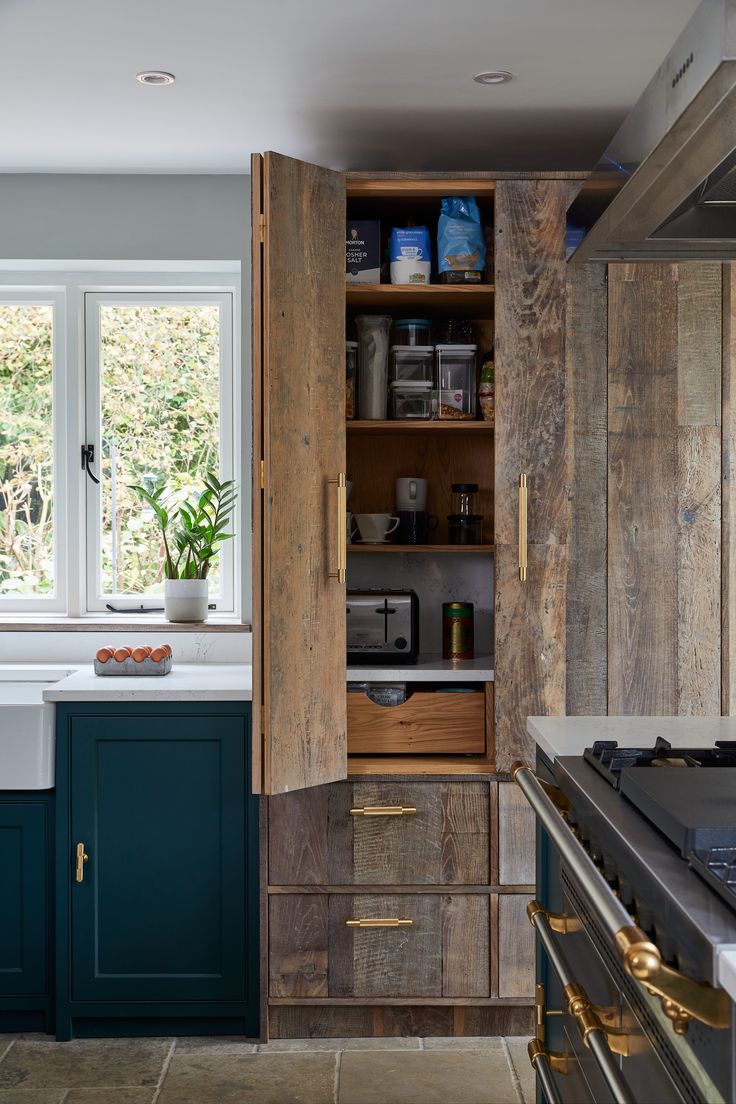 a kitchen with an oven, sink and cabinets in the middle of it is shown