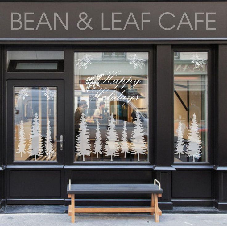 a bench sitting in front of a store window