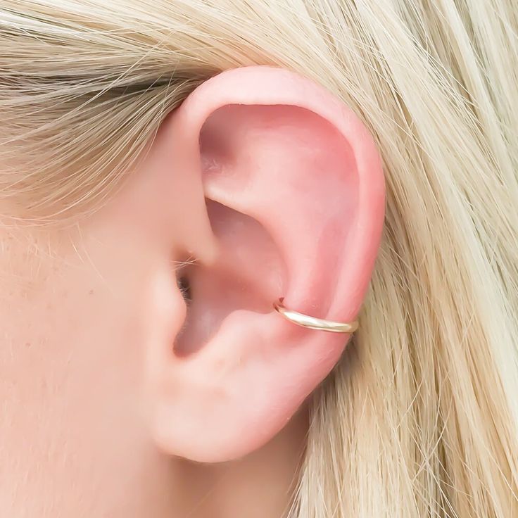 • • • Solid 14K gold, non pierced conch ear cuff. • • •• • Each 14K piece of jewelry is stamped 14K for authenticity.•• Nickel free ••• 14K gold ear cuff, 12mm in diameter, created to sit on the lower cartilage of the ear, or the "conch".• Handcrafted out of 14 gauge half round wire, approx. 2mm wide. • Adjustable for a comfortable fit. No piercing required. 14k Gold Ear Cuff, Ear Cuff Gold, Minimalist Ear Cuff, Cartilage Ear Cuff, Conch Earring, Gold Ear Cuff, Ear Cuff Earings, Gold Cuffs, Pillow Box